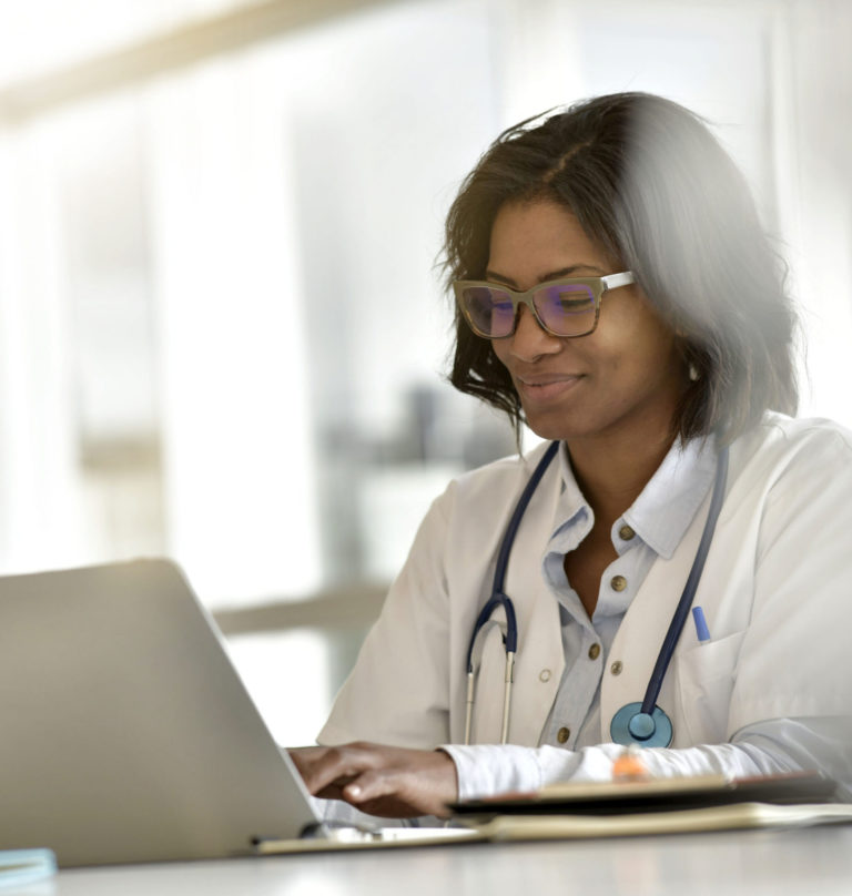 a doctor working with laptop
