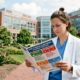clinician with GEMMSONE guide to reducing claims in speicalty practices